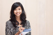 Photo: asian businesswoman doing her task with pleasure asian businesswoman doing her task with pleasure