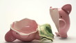 Piggy bank splitting in two halves with cash inside