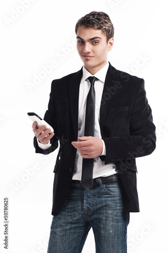 Photo: Young happy man holding mobile phone Young happy man holding mobile phone