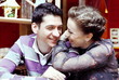 Young Smiling Couple in Cafe