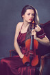 Photo: Beautiful girl posing with a fiddle Beautiful girl posing with a fiddle