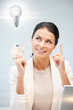 woman with cash euro money and light bulb