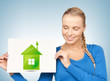 woman with illustration of green eco house
