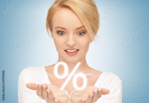 Photo: woman showing sign of percent in her hands woman showing sign of percent in her hands