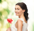 young and beautiful woman with flower