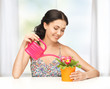 housewife with flower in pot and watering can