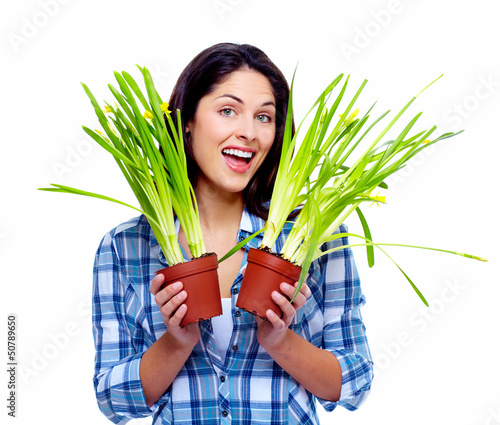 Photo: Gardening woman with plant. Gardening woman with plant.