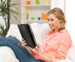 woman with tablet pc computer or touchpad indoors