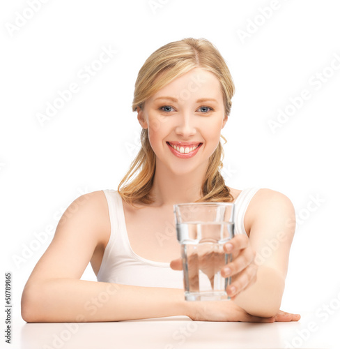 Photo: young smiling woman with glass of water young smiling woman with glass of water