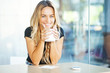 woman drinking coffee in the morning at restaurant
