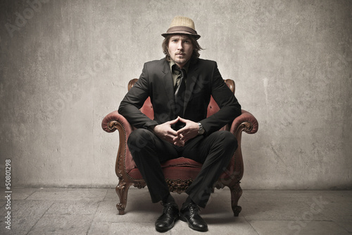 Photo: man on armchair man on armchair