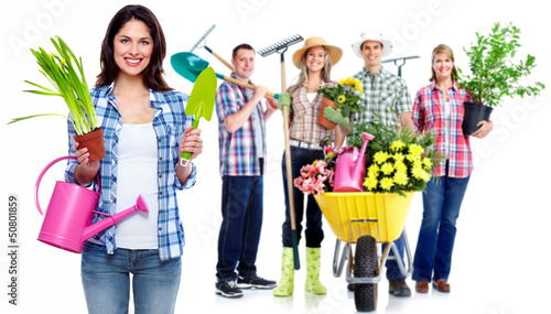 Photo: Group of gardening people with plant. Group of gardening people with plant.