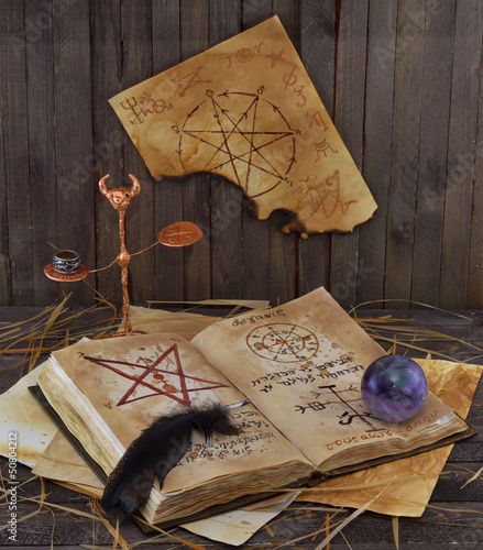 Photo: Magic book with ball and pentacle on the wall Magic book with ball and pentacle on the wall