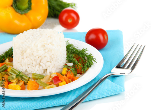 Photo: Delicious risotto with vegetables isolated on white Delicious risotto with vegetables isolated on white