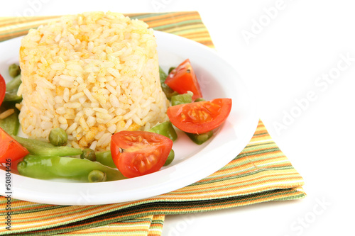 Photo: Delicious risotto with vegetables isolated on white Delicious risotto with vegetables isolated on white