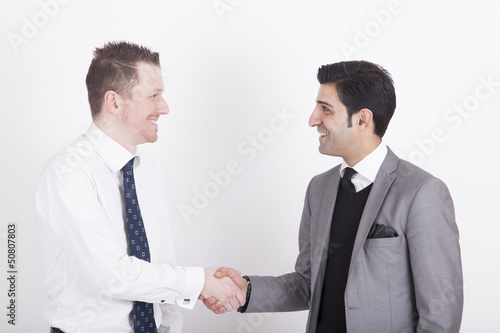 Photo: handshaking business partners handshaking business partners