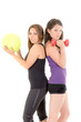 Two women doing exercises with barbell  and ball
