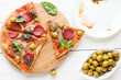 slices of pizza and an empty dish