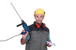 Man holding drill and plans