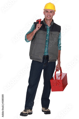 Photo: Man holding wrench and tool-box Man holding wrench and tool-box