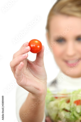 Photo: Woman holding a salad bowl Woman holding a salad bowl