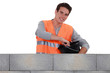 Mason with bucket and trowel