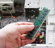 Hands holding PC RAM
