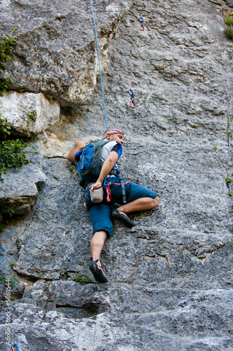 Photo: Man practices in climbing at the rock in the Crimea mountains Man practices in climbing at the rock in the Crimea mountains