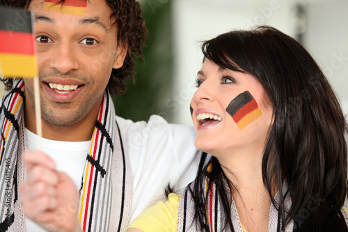 Photo: Couple supporting the German football team Couple supporting the German football team