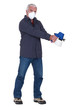Tradesman holding a spray gun and wearing a mask