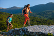 Two women is trekking in the Crimea mountains with backpacks
