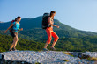 Two women is trekking in the Crimea mountains with backpacks