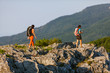 Two women is trekking in the Crimea mountains with backpacks