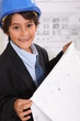 Little boy imitating architect