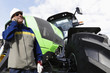farmer standing in front of his tractor