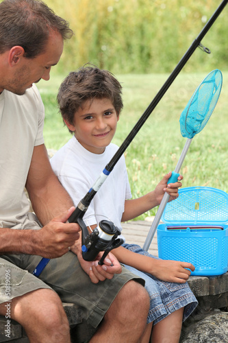 Photo: Father and son fishing together Father and son fishing together