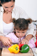 Daughter cooking with mother