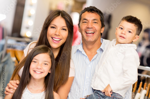 Photo: Happy family in a clothing store Happy family in a clothing store