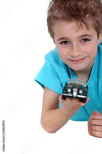 Photo: Boy with a toy car Boy with a toy car