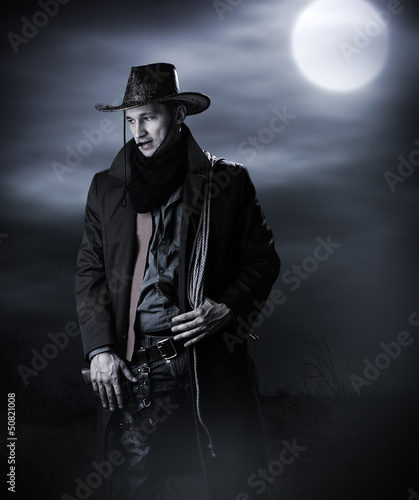 Photo: Handsome man in cowboy costume Handsome man in cowboy costume
