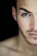 Portrait of a beautiful young man half face