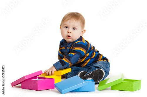 Photo: baby boy and gift box isolated on white. Portrait of happy beau baby boy and gift box isolated on white. Portrait of happy beau