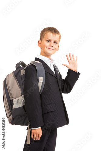 Photo: Schoolboy sitting on books Schoolboy sitting on books