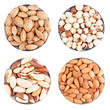 Assorted nuts on a flat plate, isolated on white
