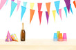 Bottle of sparkling wine, plastic glasses and party hats