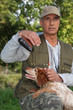 Hunter with shotgun and spaniel
