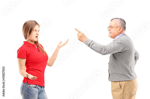 Photo: Angry father reprimanding his teenage daughter Angry father reprimanding his teenage daughter