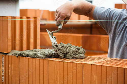Photo: Bauarbeiter auf einer Baustelle Bauarbeiter auf einer Baustelle