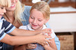 Children playing with mother
