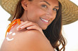 Photo: Woman using suncream Woman using suncream